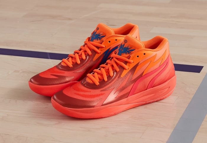 Red and orange Puma basketball shoes.